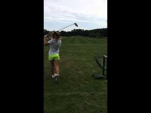 Video of Olivia on driving range with driver