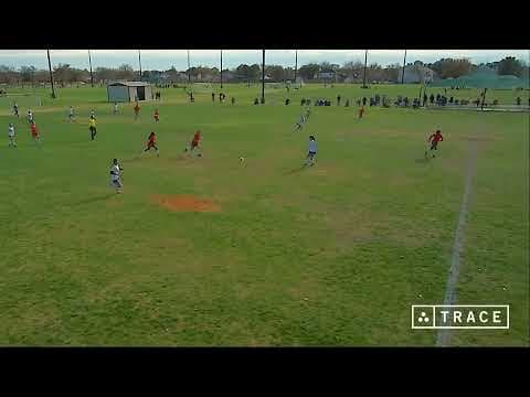 Video of Evelyn, white jersey #3, clearing the ball, passing to her forward in white #53