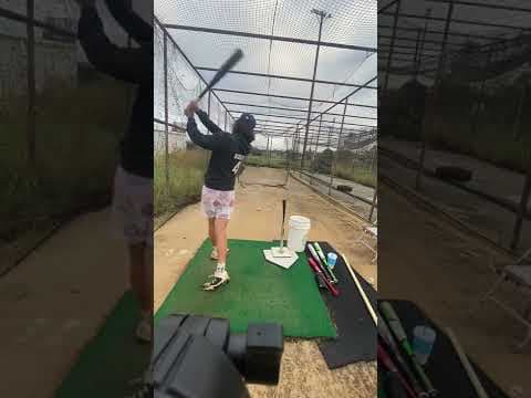 Video of Tee hitting from behind home plate 