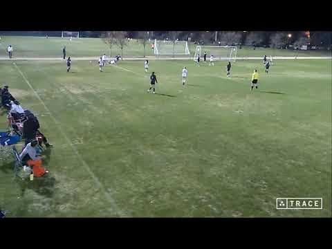 Video of Evelyn, white jersey #3, at the beginning of the play, placing pressure on the opposing forward