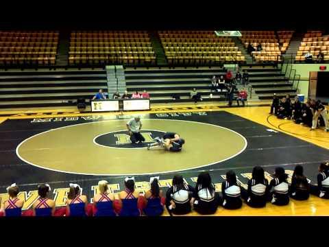 Video of Justin wrestling in Moore black singlet with blue M onside at Moore vs Midwest City Dual at 106 lb