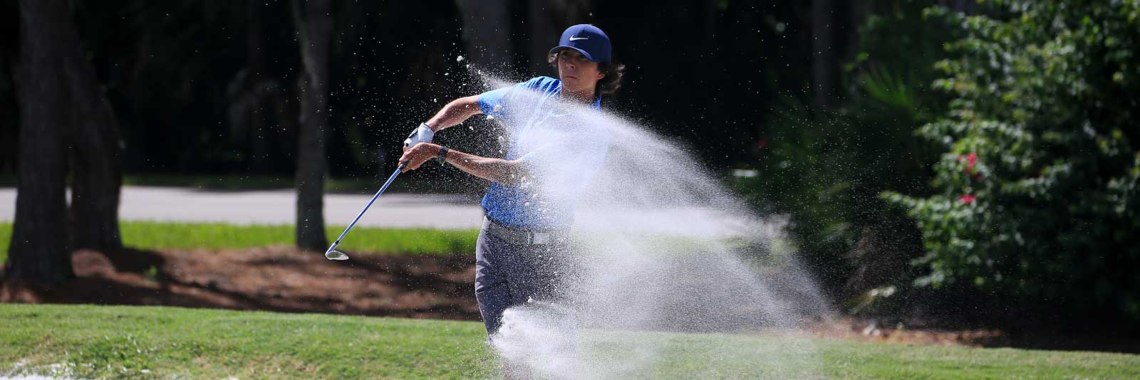 Male golfer swinging